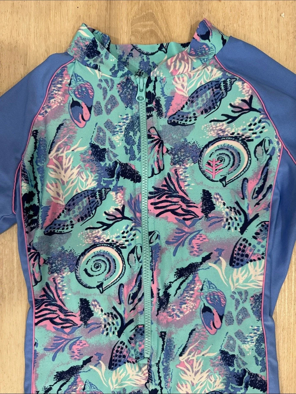 Coolibar toddler girl neck to knee Blue Seashell Print Zip-Front swimwuit